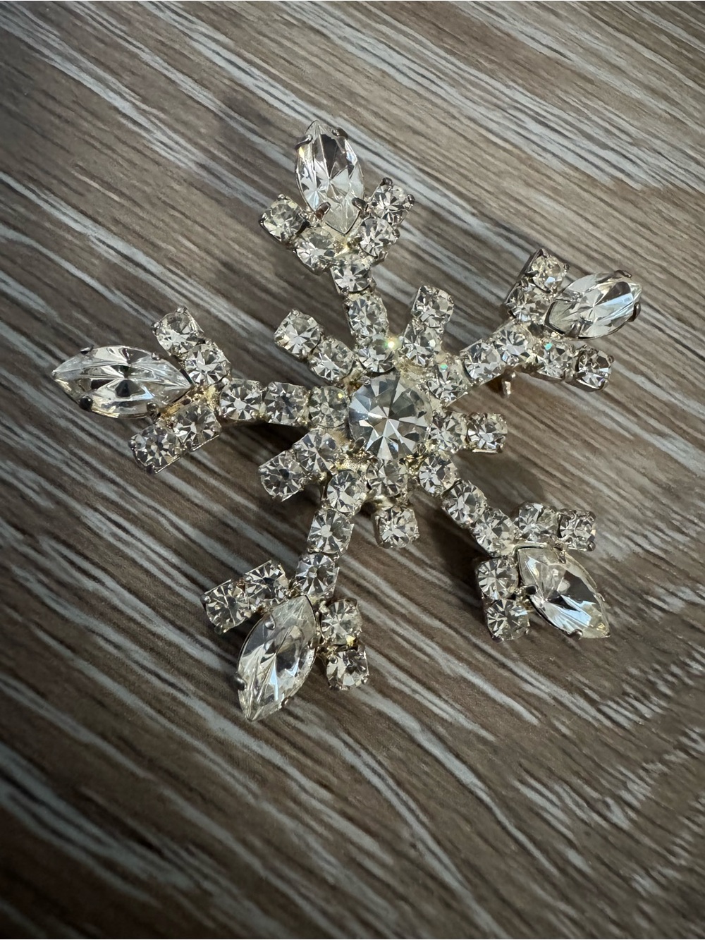 OTC vintage snowflake silver tone brooch with clear gemstones